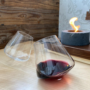 Pair of two 12 oz Swoon Revolving Wine Glasses. The Swoon glasses revolve on almost any surface. This helps aerate your beverage, prevent spilling, and it makes drinking even more fun.   These glasses are hand blown and are hand wash recommended  . 