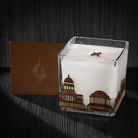 Image of a 4x4x4 soy candle featuring a mahogany scent, crackling wood wick, with a wood lid and a Washington, DC skyline wrap design.
