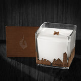 Image of a 4x4x4 soy candle featuring a mahogany scent, crackling wood wick, with a wood lid and a Memphis, TN City skyline wrap design.
