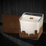 Image of a 4x4x4 soy candle featuring a mahogany scent, crackling wood wick, with a wood lid and a Phoenix City skyline wrap design.