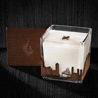 Image of a 4x4x4 soy candle featuring a mahogany scent, crackling wood wick, with a wood lid and a San Francisco skyline wrap design.