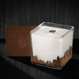 Image of a 4x4x4 soy candle featuring a mahogany scent, crackling wood wick, with a wood lid and a San Jose skyline wrap design.