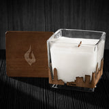Image if a 3x3x3 soy candle featuring a mahogany scent, crackling wood wick, with a wood lid and an Atlanta skyline wrap design.