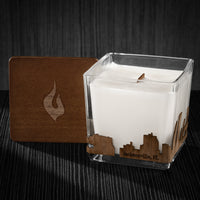 Image of a 3x3x3 soy candle featuring a mahogany scent, crackling wood wick, with a wood lid and an Jacksonville, FL skyline wrap design.