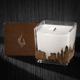 Image of a 3x3x3 soy candle featuring a mahogany scent, crackling wood wick, with a wood lid and a Kansas City skyline wrap design.