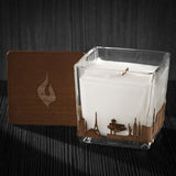 Image of a 3x3x3 soy candle featuring a mahogany scent, crackling wood wick, with a wood lid and a Las Vegas City skyline wrap design.