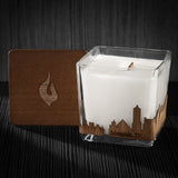 Image of a 3x3x3 soy candle featuring a mahogany scent, crackling wood wick, with a wood lid and a Memphis, TN City skyline wrap design.