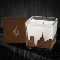Image of a 3x3x3 soy candle featuring a mahogany scent, crackling wood wick, with a wood lid and a Orlando, FL City skyline wrap design.