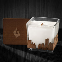 Image of a 3x3x3 soy candle featuring a mahogany scent, crackling wood wick, with a wood lid and a Phoenix City skyline wrap design.