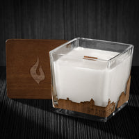 Image of a 3x3x3 soy candle featuring a mahogany scent, crackling wood wick, with a wood lid and a Roanoke City skyline wrap design.