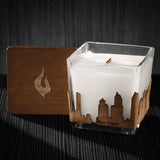Image of a 3x3x3 soy candle featuring a mahogany scent, crackling wood wick, with a wood lid and a San Diego skyline wrap design.