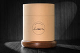 12oz revolving glass with a reversible wood coaster inside of quality made storage container. 