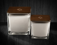 Image of a 3x3x3 and 4x4x4 soy candles to compare the difference in size.